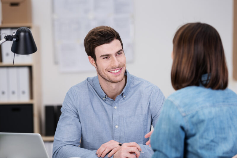 28 Signs A Female Coworker Likes You And What To Do