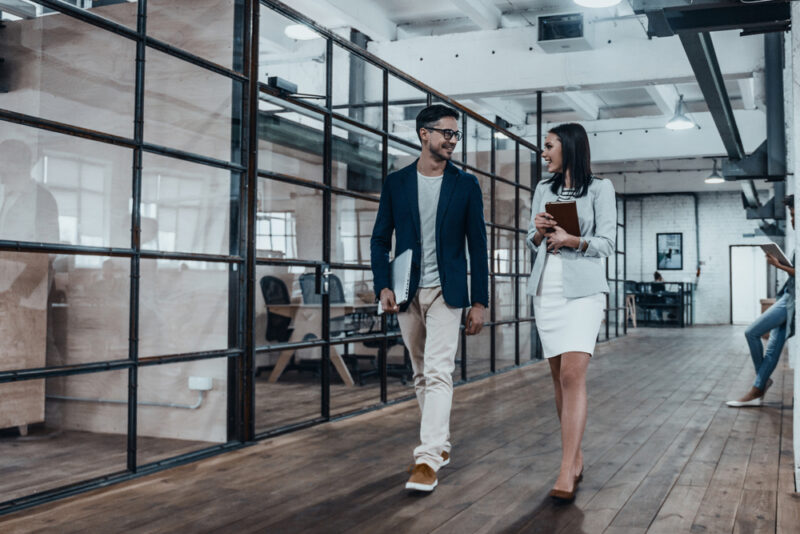 28 Signs A Female Coworker Likes You And What To Do