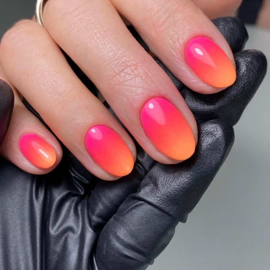 8. Striking neon orange nails 2