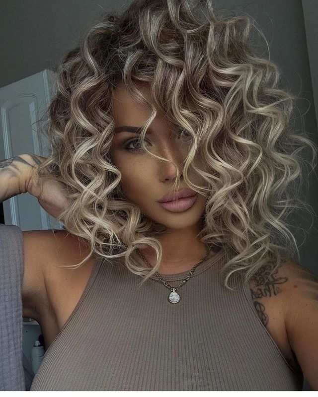 A jaw dropping curly medium length hairstyle