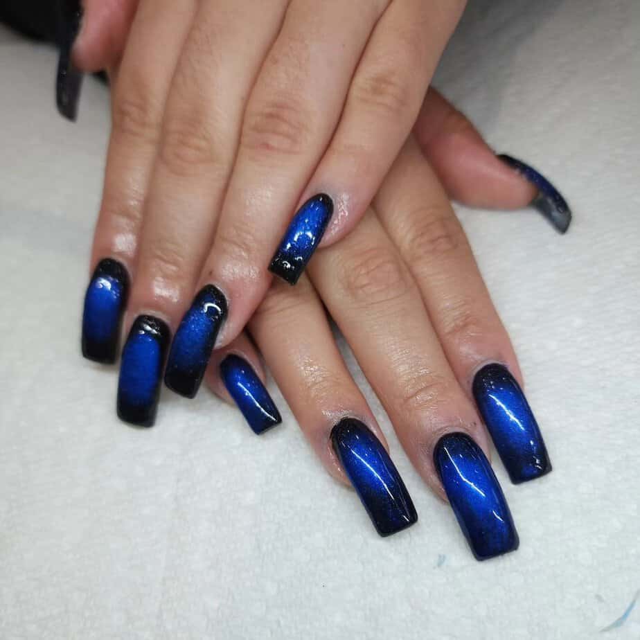 10. Midnight galaxy blue nail designs