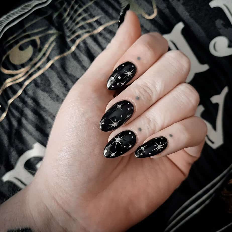 10. Starry night black nail art