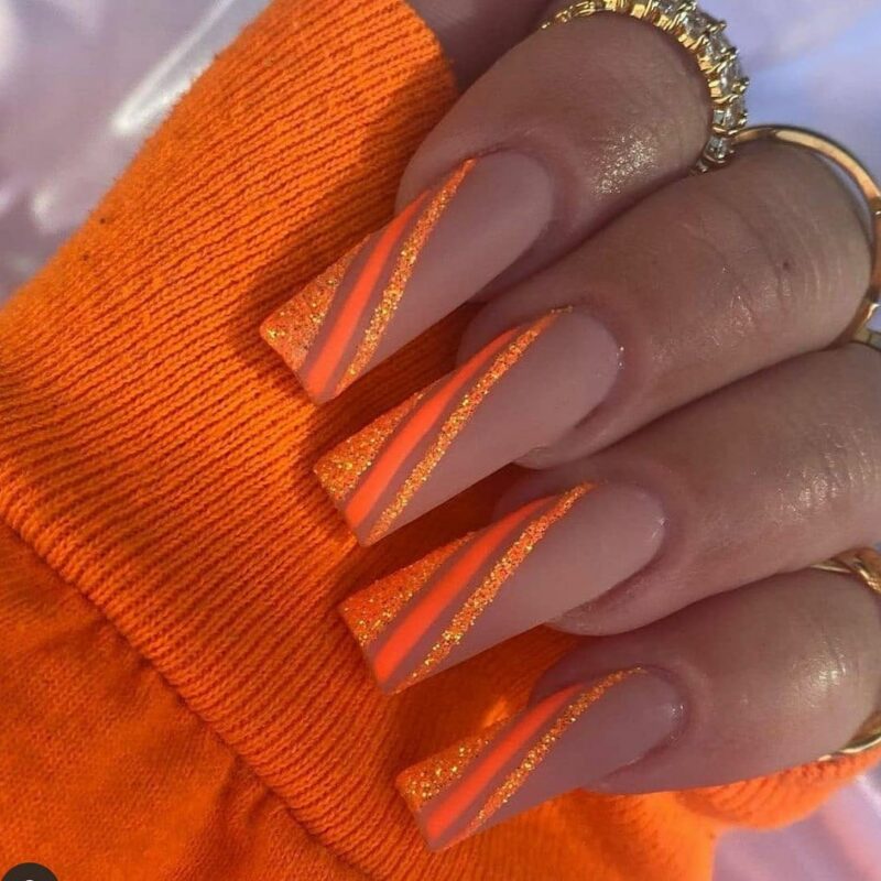 11. Orange glitter nails 1