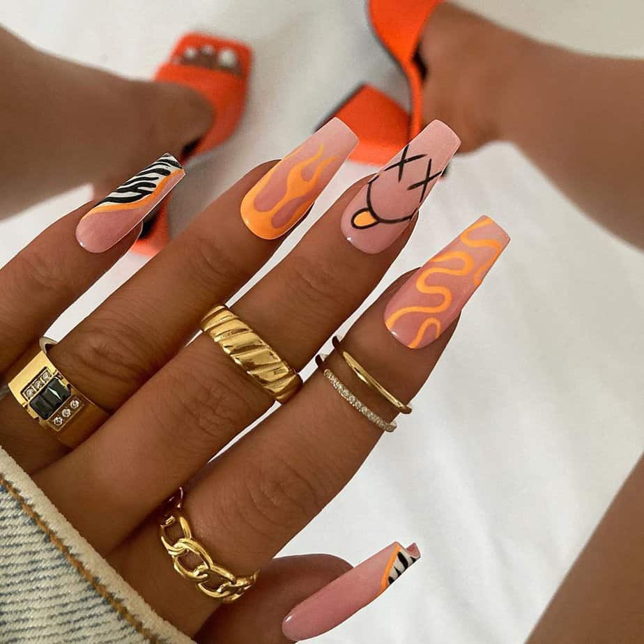 12. Festive orange nails