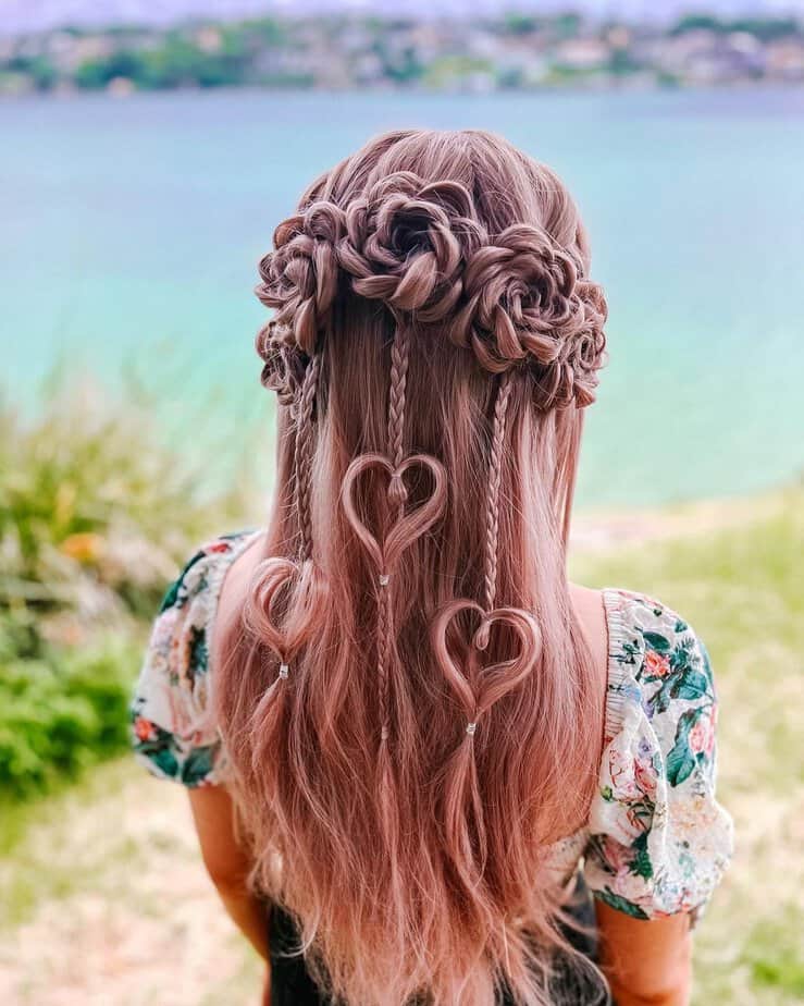 12. Romantic heart shaped braids with floral accents