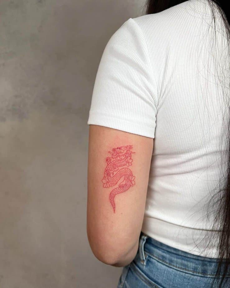 15. A blossoming red dragon tattoo
