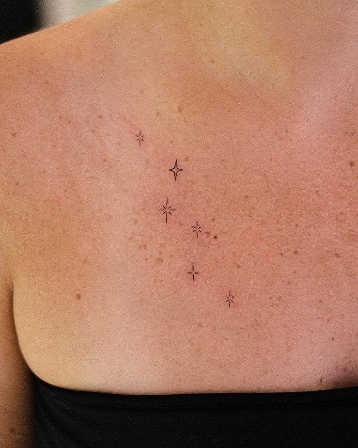 15. A tattoo of sparkles that blend with the freckles on the chest
