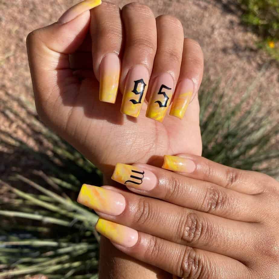 16. Zodiac yellow nails