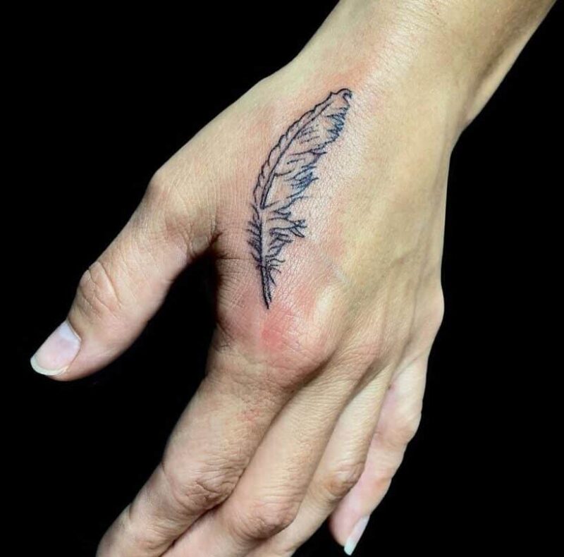 18 Elite Feather On Hand Tattoos Handy Symbols Of Freedom 819x809 1