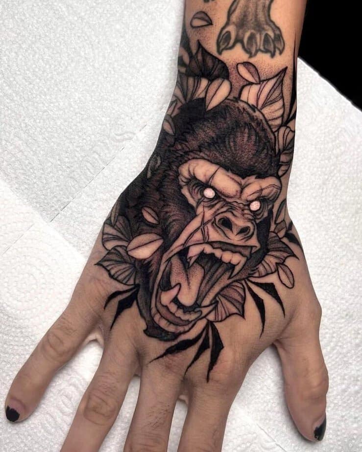 14. A tattoo of a gorilla on the hand 