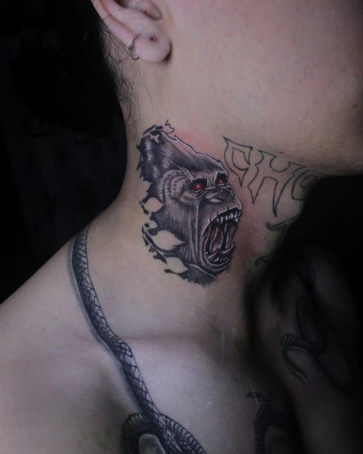 16. A gorilla tattoo on the side of the neck