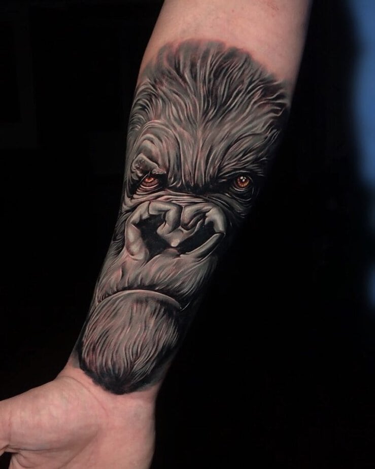19. A realistic gorilla tattoo on the inside of the arm
