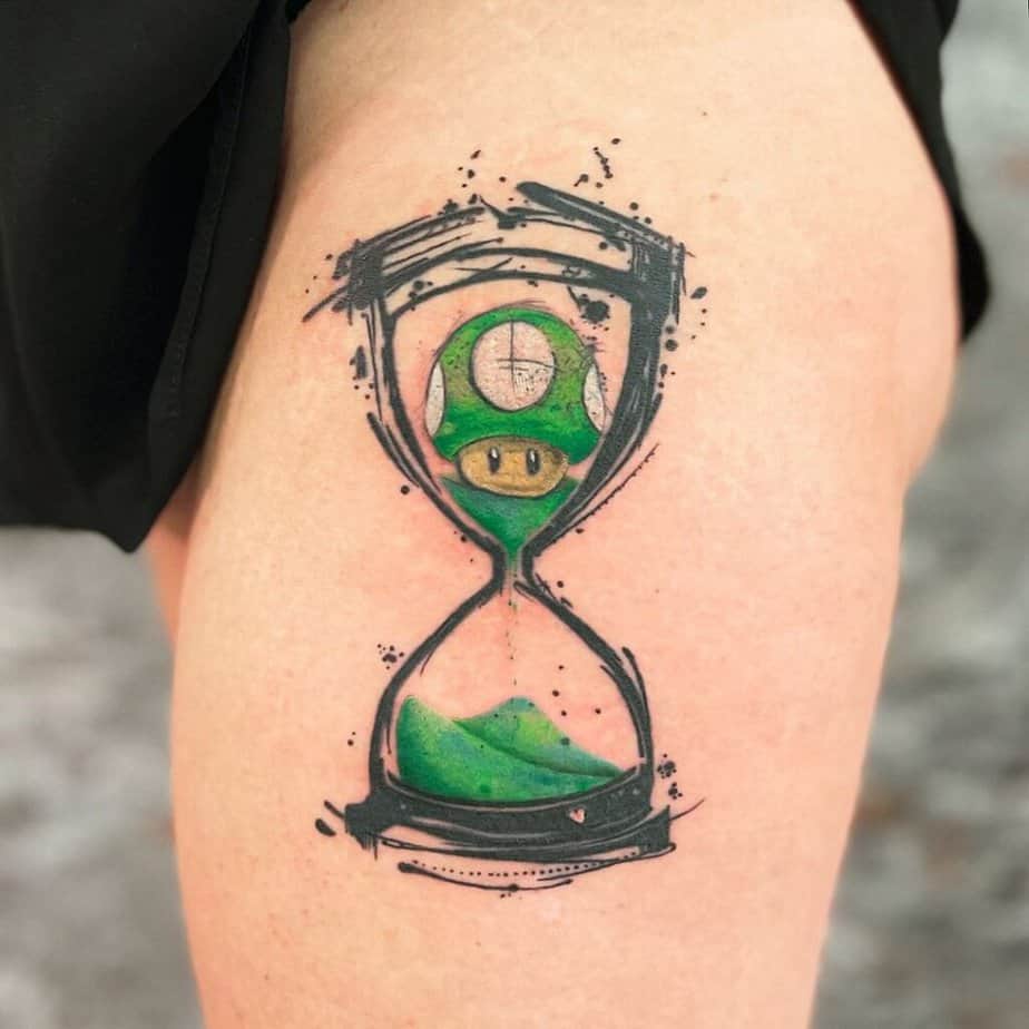 7. Hourglass tattoo with a 1-Up Mushroom from Super Mario