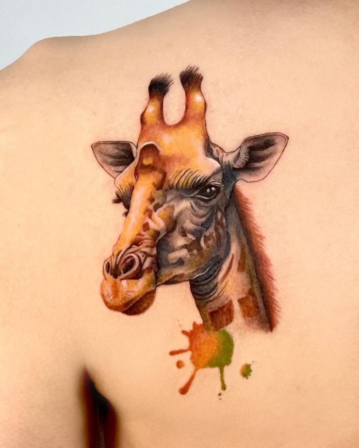 10. Watercolor giraffe tattoo