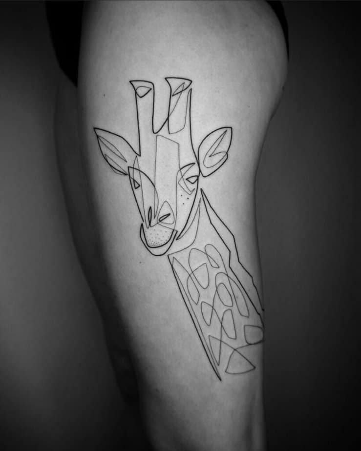 3. Geometric giraffe tattoo
