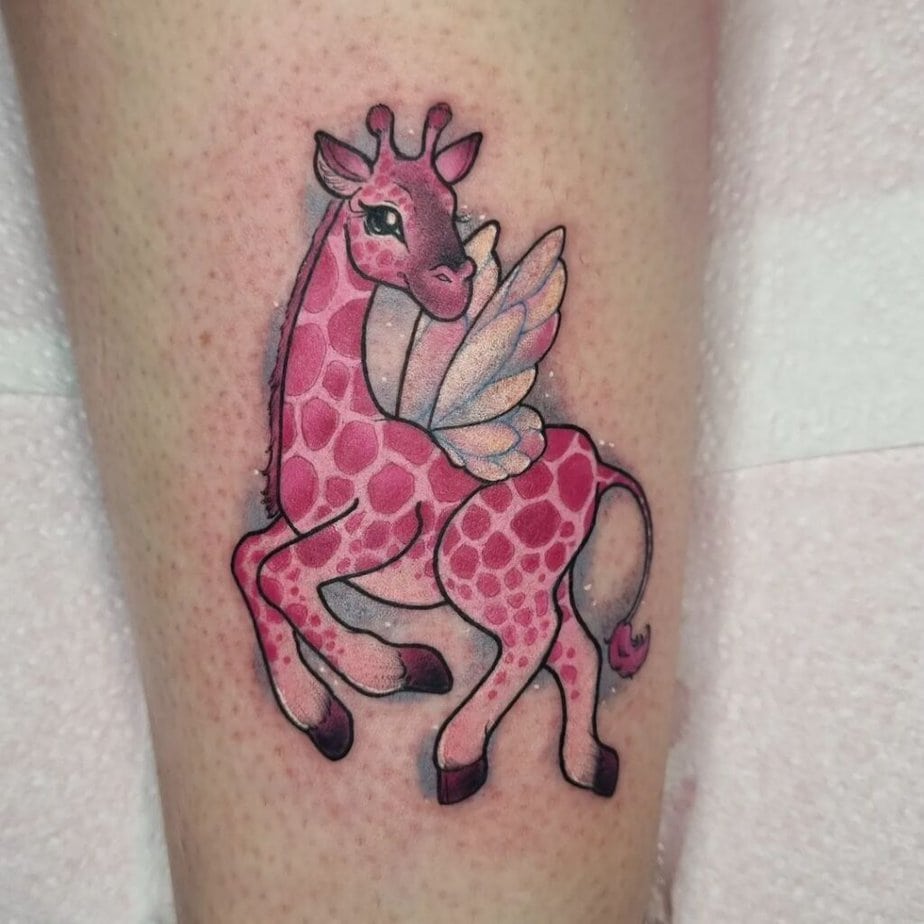 8. Sweet pink giraffe tattoo