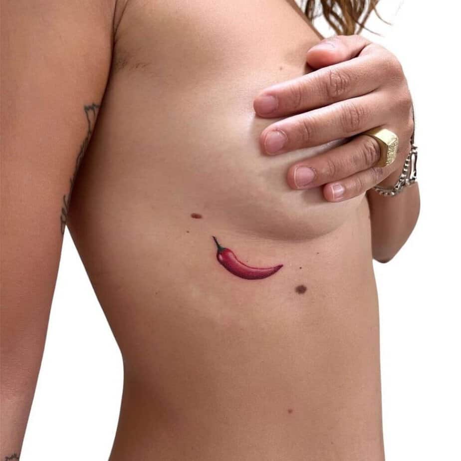 11. A chili pepper tattoo on the ribcage 