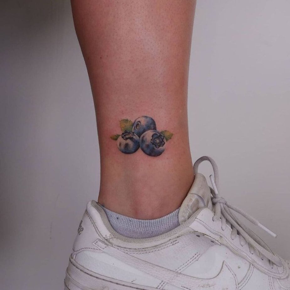 17. A blueberry tattoo on the ankle 