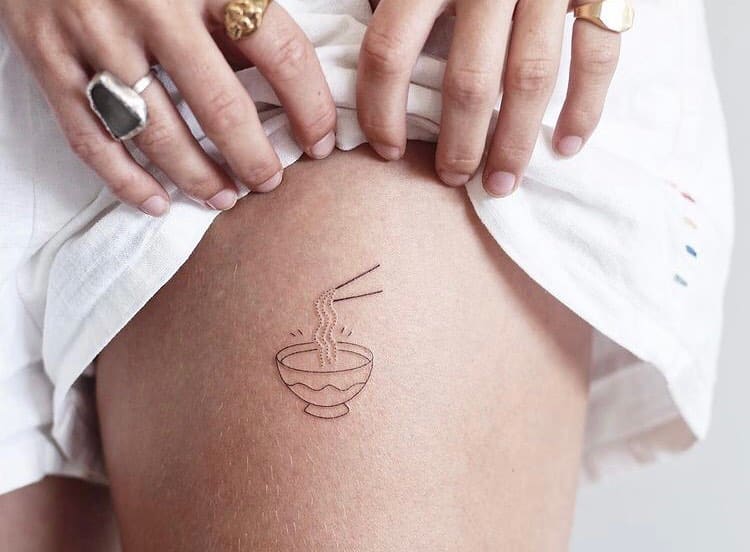 6. A linework ramen tattoo on the thigh