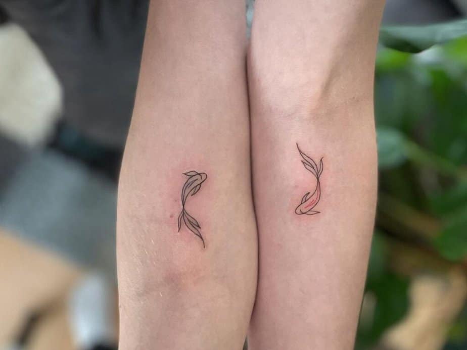 3. Matching fish tattoos
