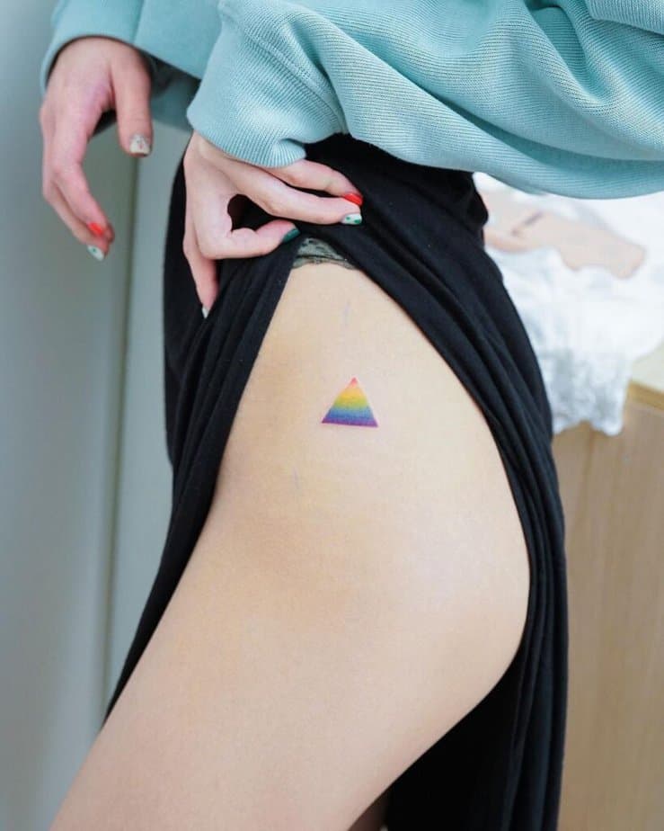 16. A rainbow triangle tattoo on the hip