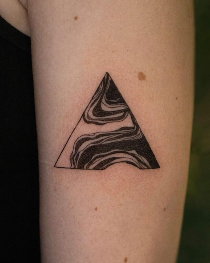 5. Abstract triangle tattoo on the upper arm