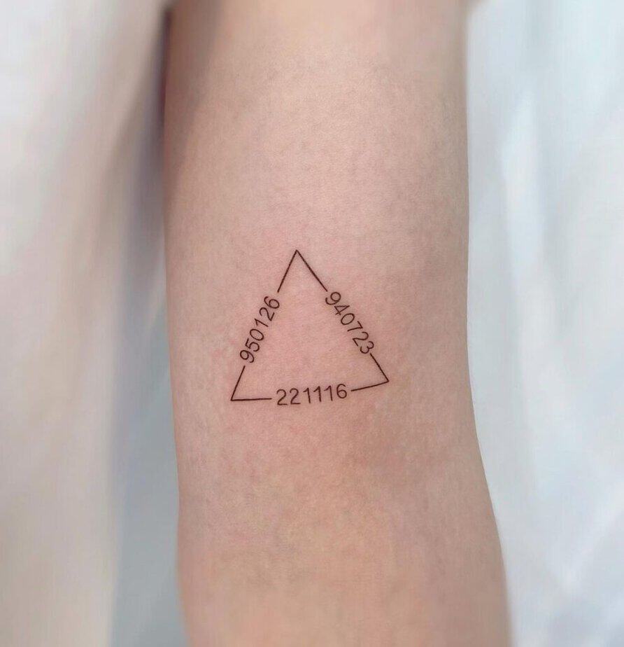 6. A triangle tattoo with numbers 