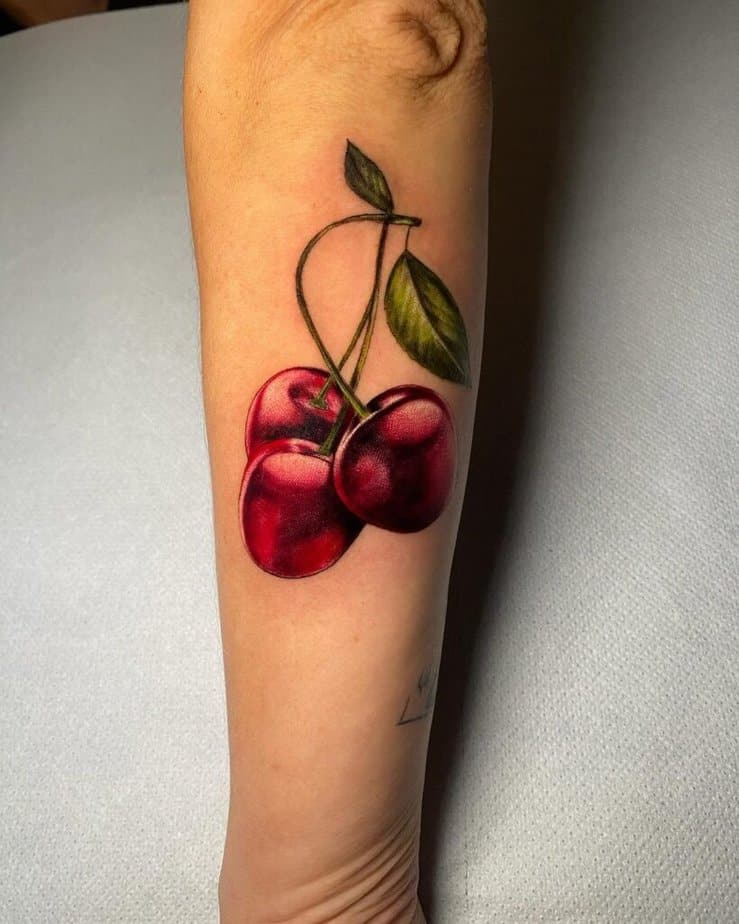 12. Realistic cherry tattoo