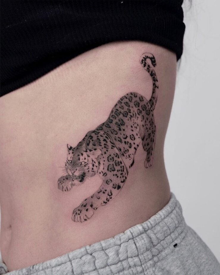 1. Full stride leopard tattoo
