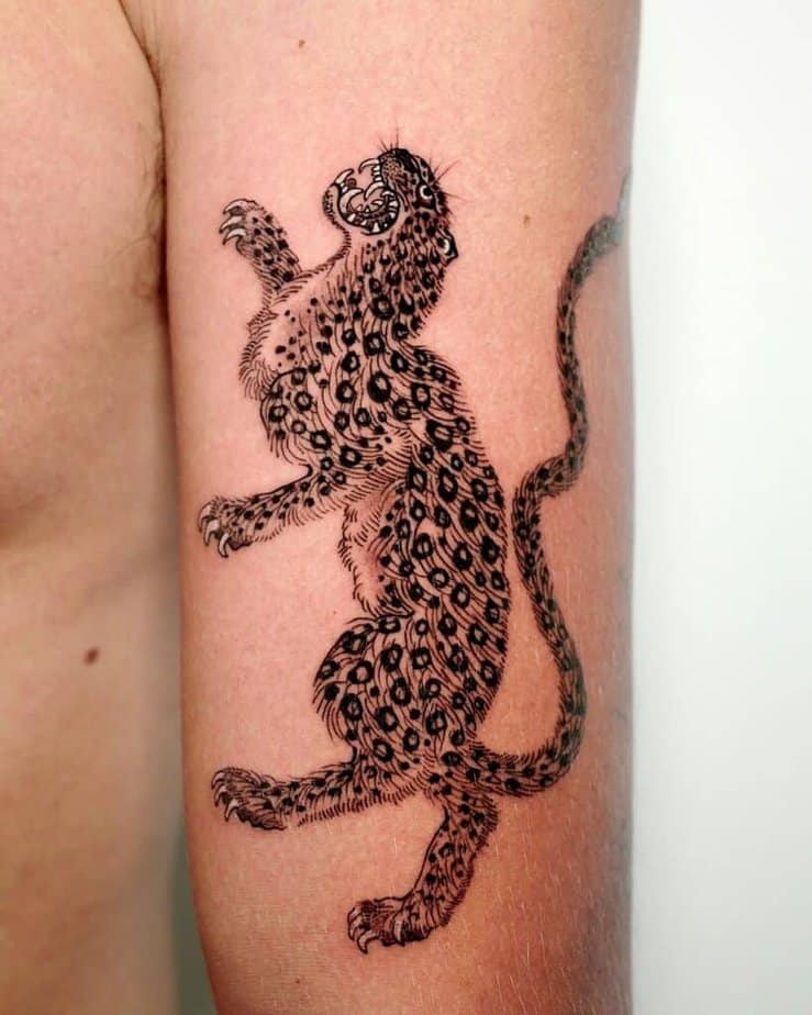 19. Feral dance leopard tattoo