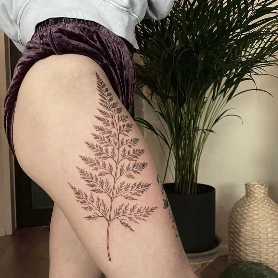 19. A fern tattoo on the thigh 