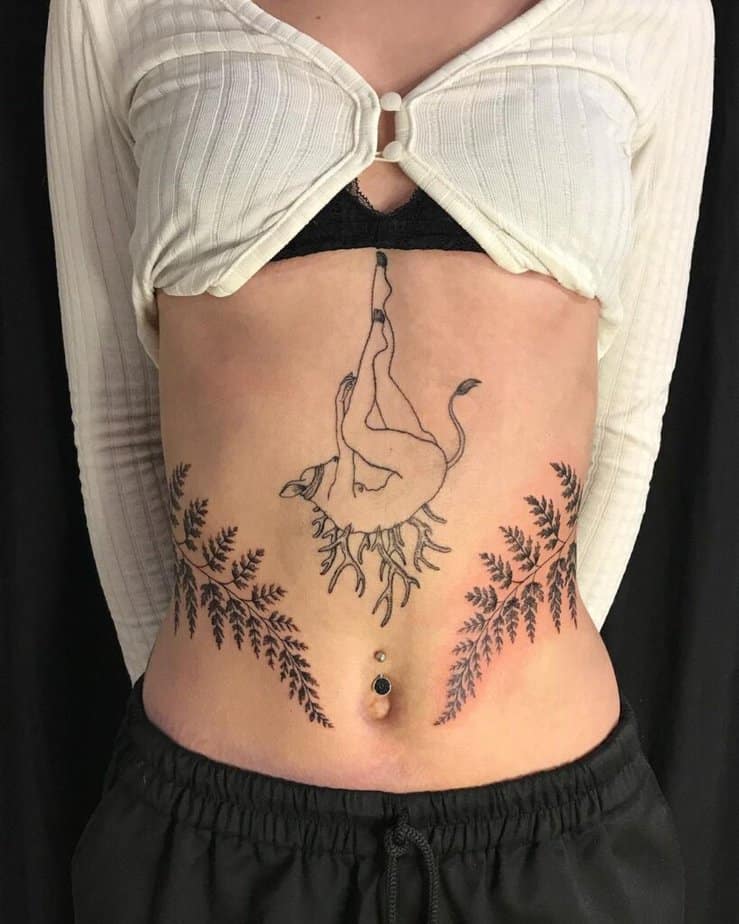 7. A tattoo of two ferns on the stomach 