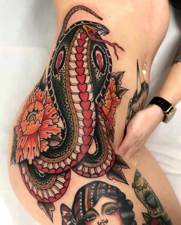 13. A traditional cobra tattoo on the hip