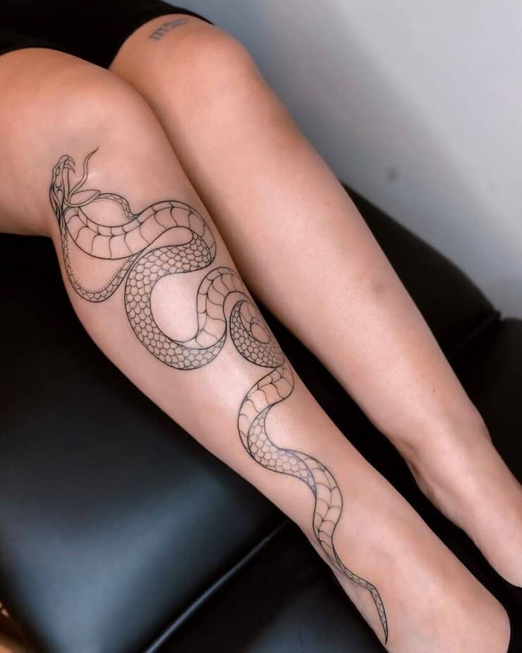 17. A cobra tattoo on the leg