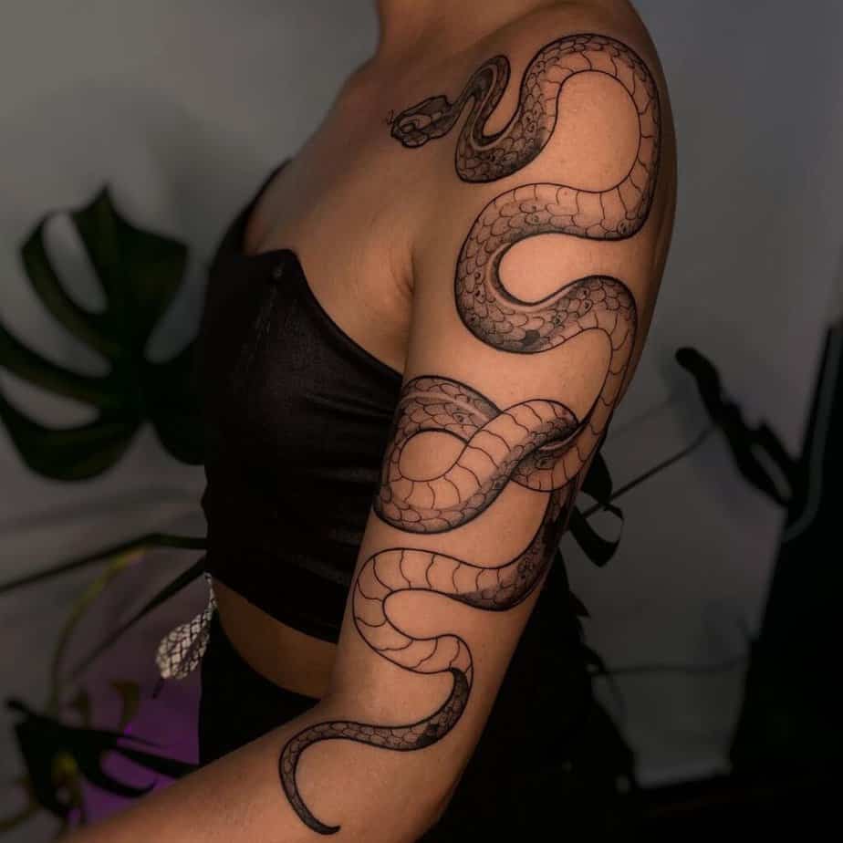 18. A cobra tattoo on the upper arm