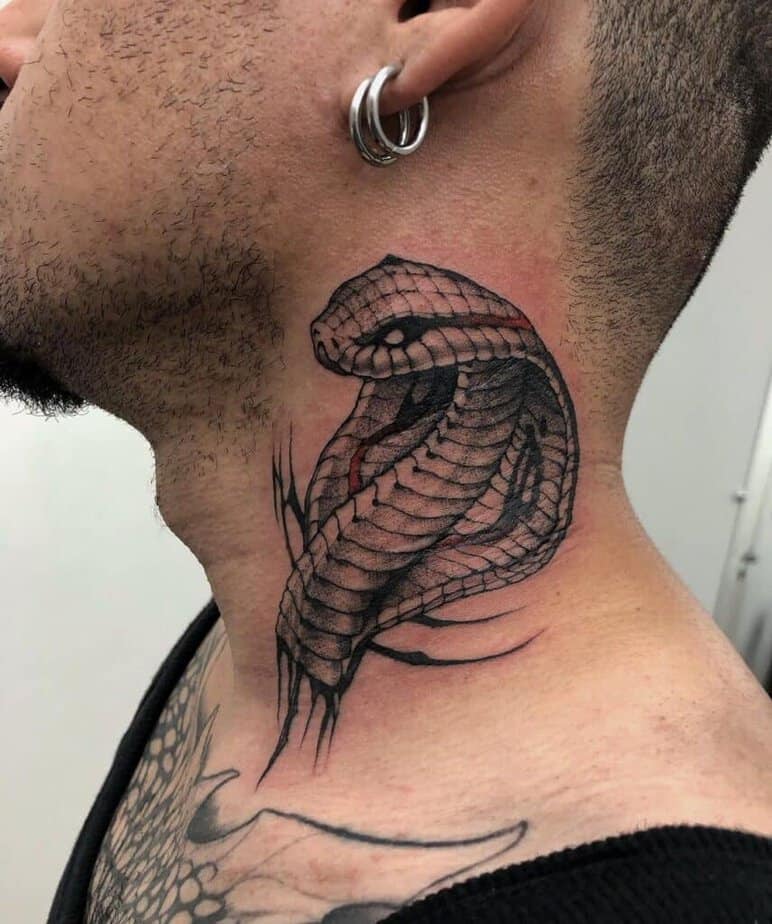 8. A cobra tattoo on the neck