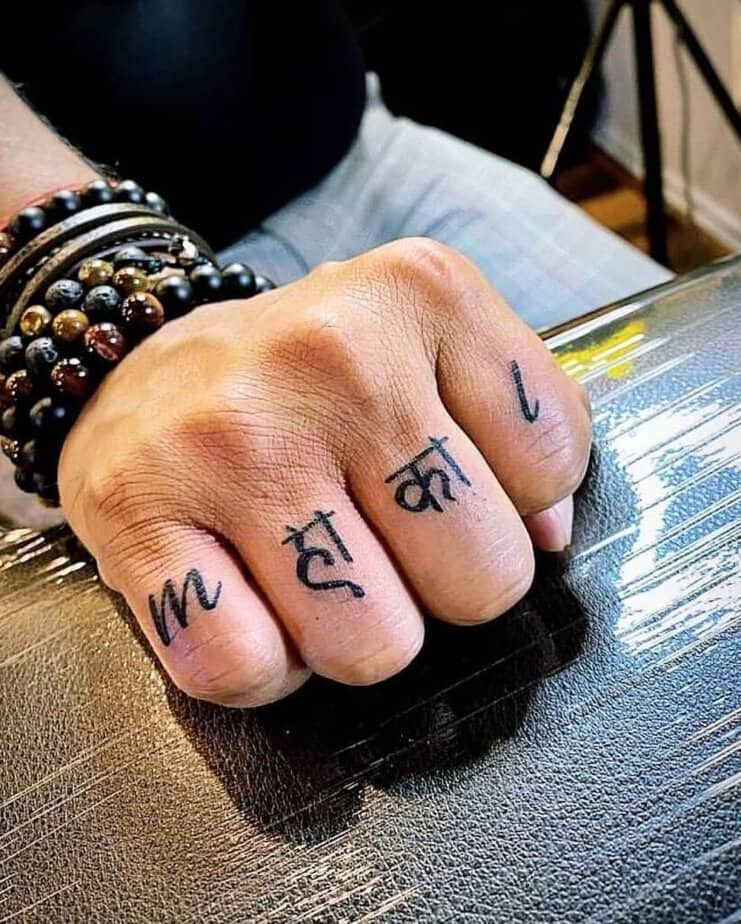 17. A Shiva tattoo on the fingers