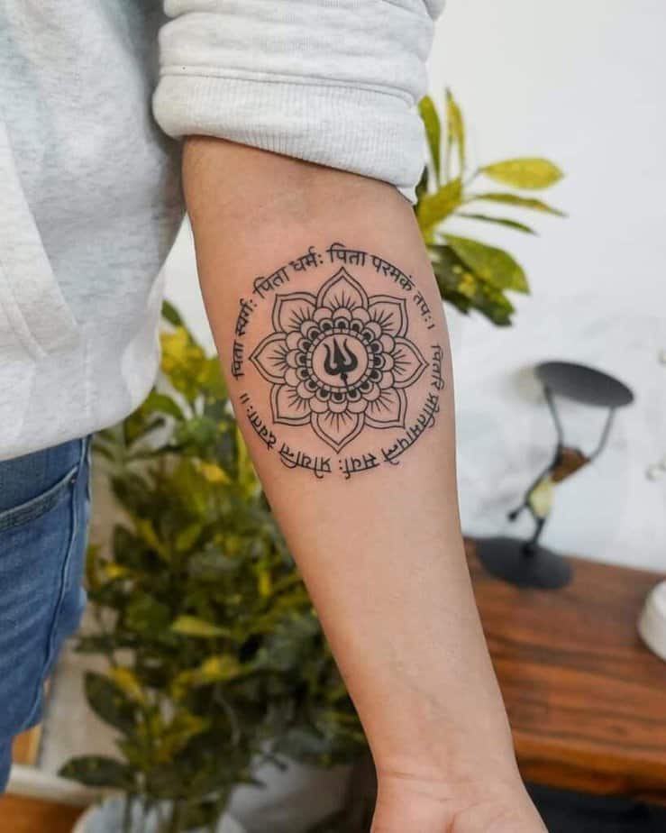 18. A circular Shiva tattoo 