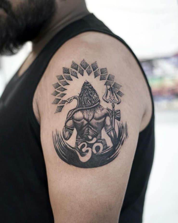 19. A mandala Shiva tattoo on the upper arm