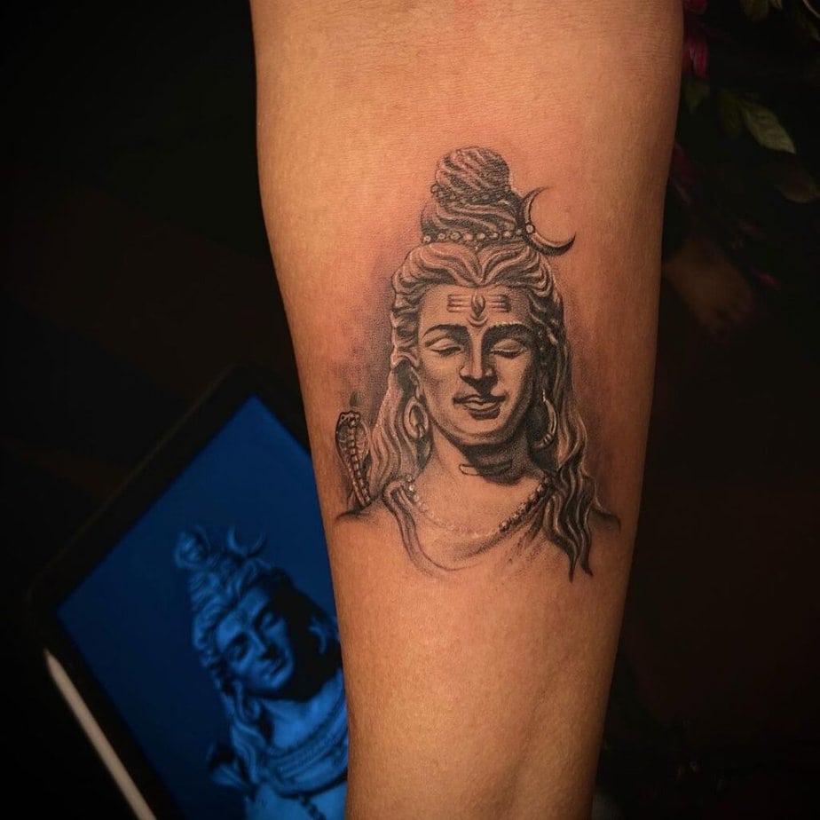 2. A simple Shiva tattoo on the forearm