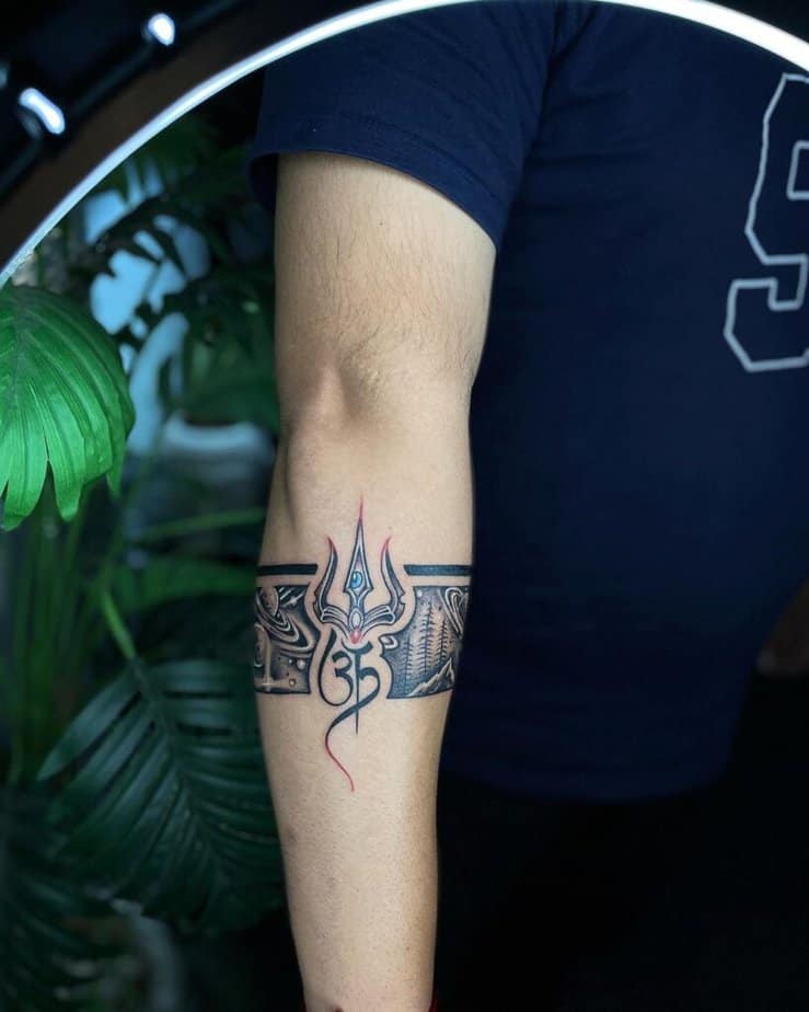 7. A wrap-around tattoo of the Shiva Trishul 