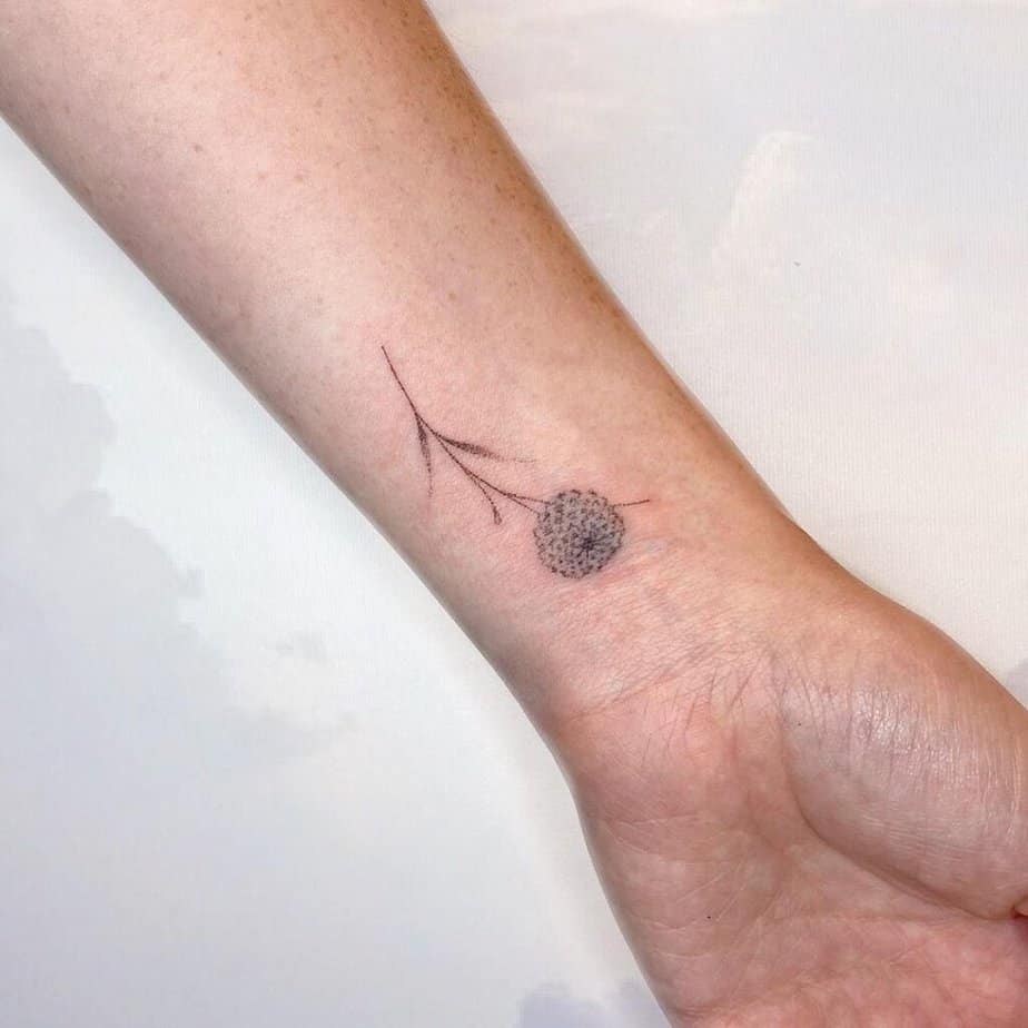 16. A tiny dahlia tattoo