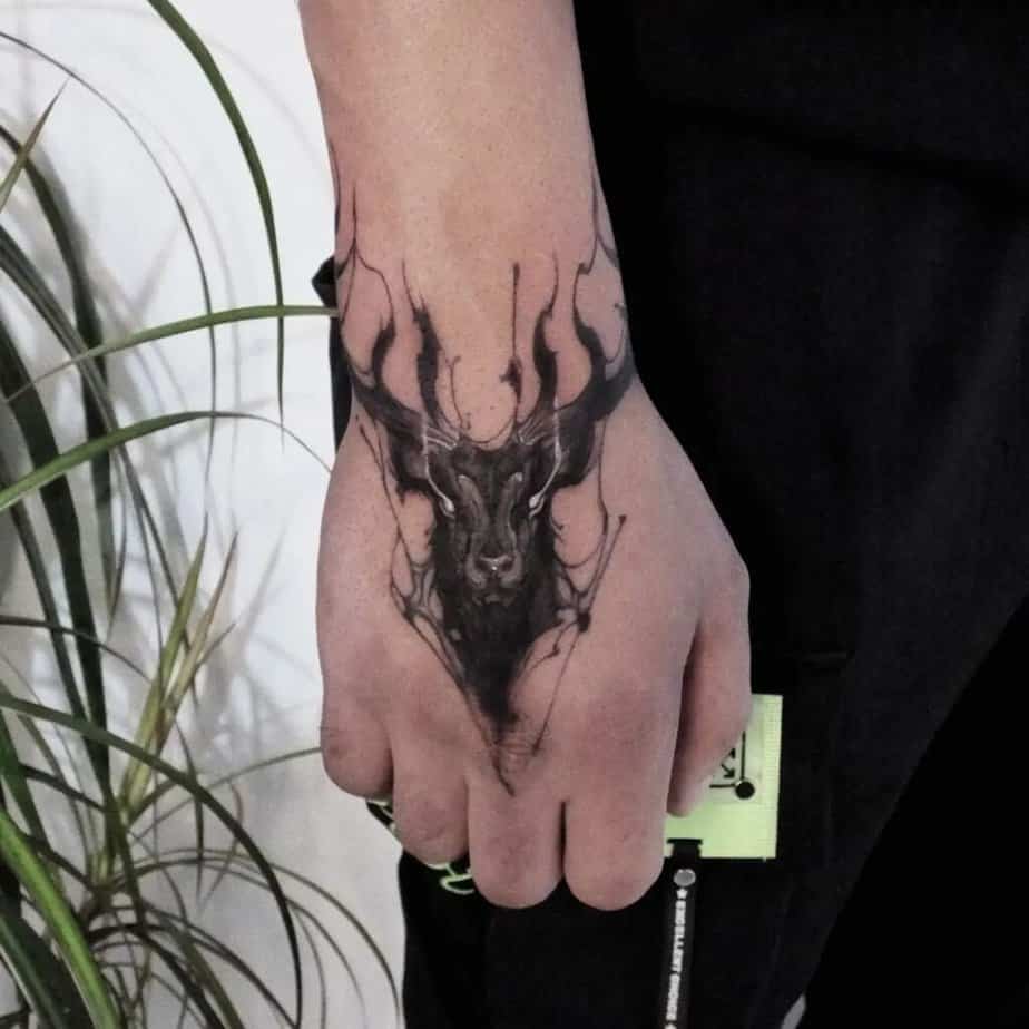 4. Abstract deer tattoo on the hand 