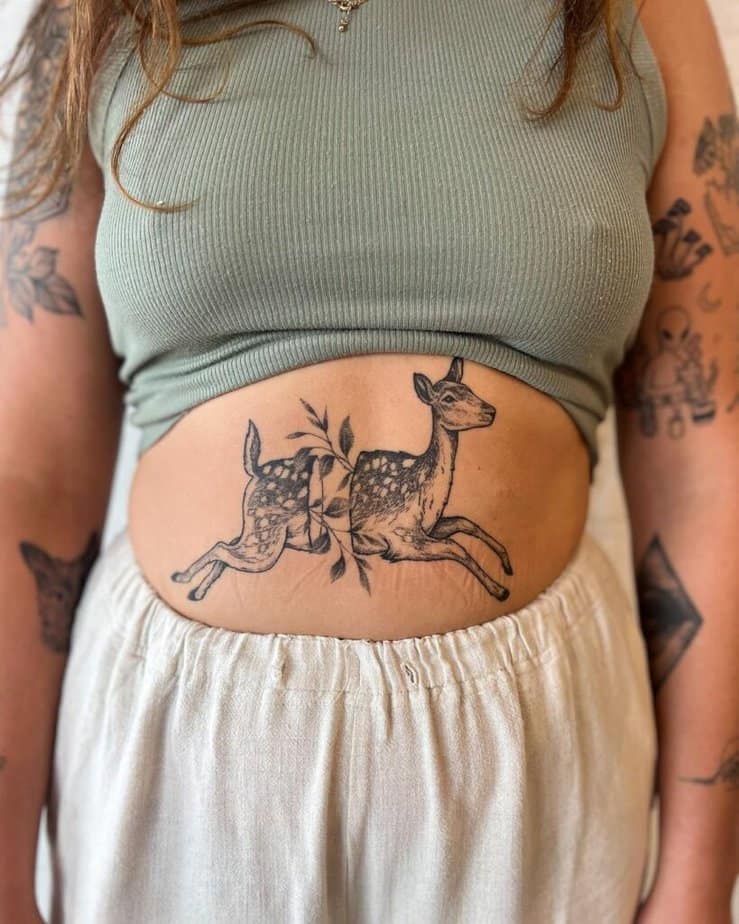 9. A deer tattoo on the stomach