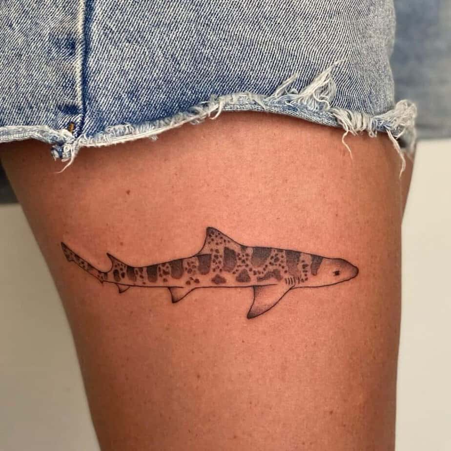 16. A leopard shark tattoo on the thigh