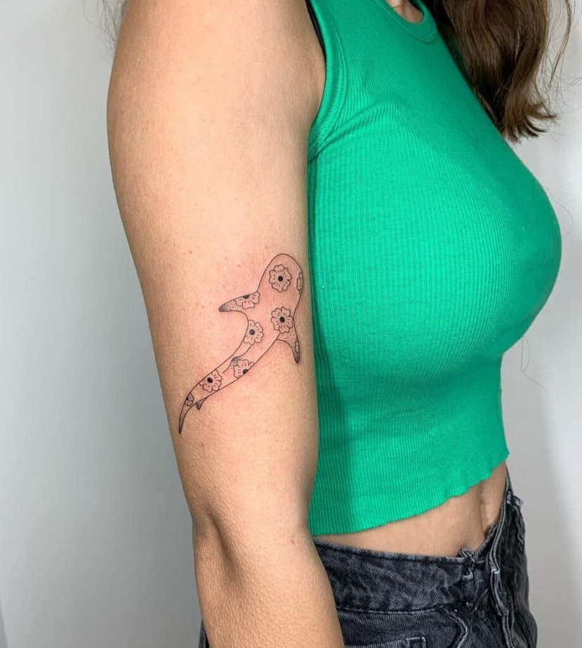 17. A floral shark tattoo