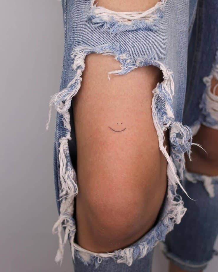 16. A dainty smiley face tattoo 