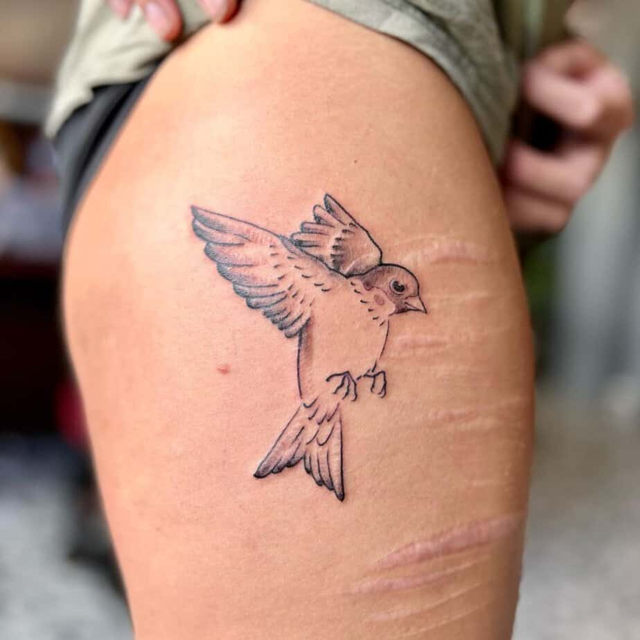 15. A sparrow tattoo on the hip