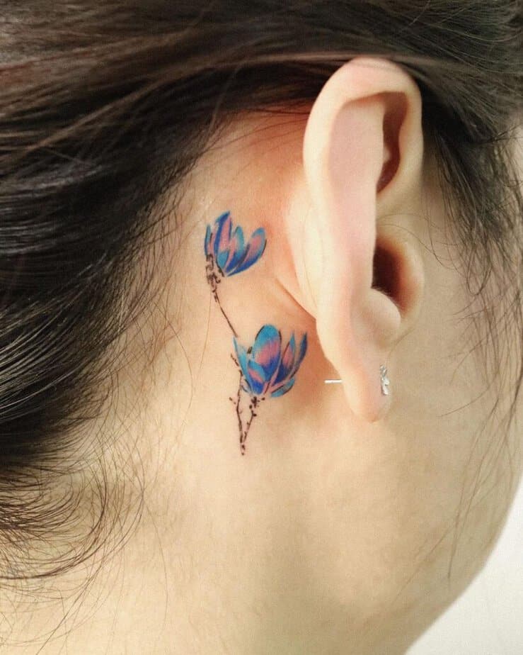 15. Colorful magnolia tattoos