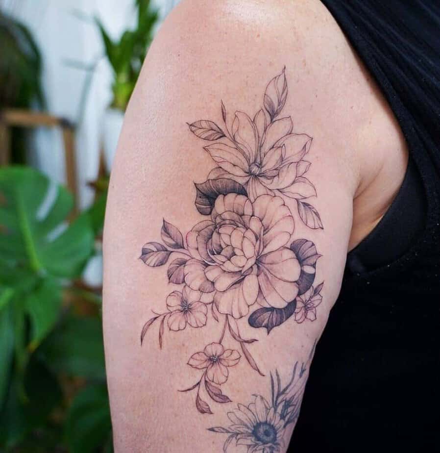 19. Fine line magnolia tattoos